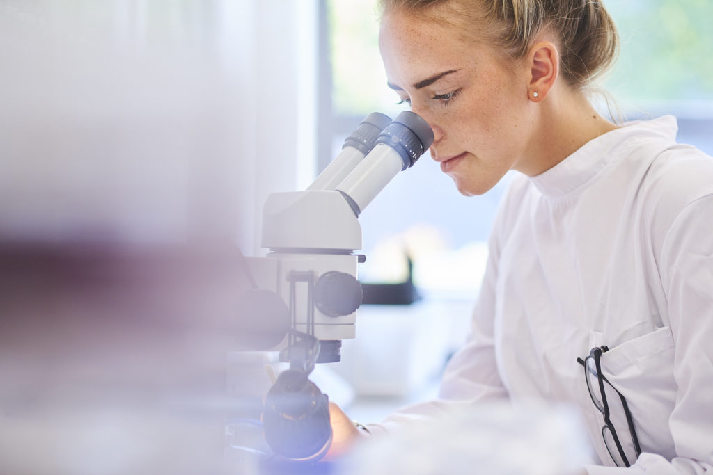 Student looking in Microscope