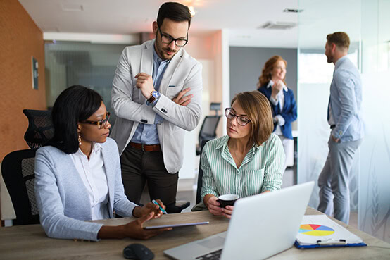 Business team studying report at table