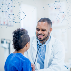 POC Medical Doctor in white lab coat smiling with stethoscope with young POC patient in blue shirt.